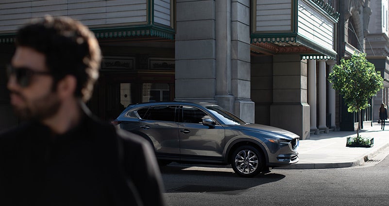 Grey 2020 Mazda CX-5 parked on the street | Open Road Mazda of Morristown in Morristown, NJ